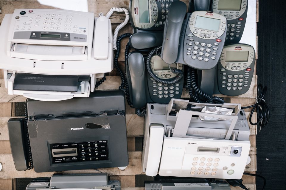Pile of fax machines